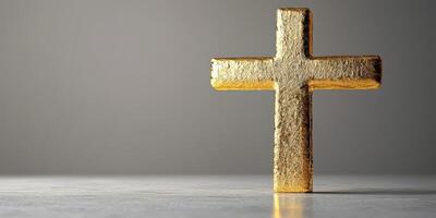Golden cross stands on a white surface illuminated by soft daylight in a minimalist setting photo