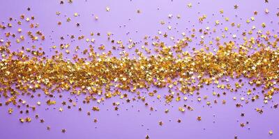 Shiny golden star confetti scattered across a pastel purple background creates a festive atmosphere photo