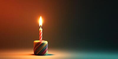 Candle burns brightly in a dimly lit setting creating a warm atmosphere and soft shadows photo