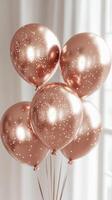 Elegant rose gold balloons with confetti create a festive atmosphere for celebrations indoors photo