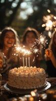 Celebration with friends around a festive cake adorned with sparklers during a joyful evening gathering outdoors photo