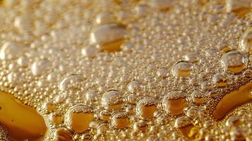 Mesmerizing interplay of golden oil droplets dancing atop the water's surface creating an artful display photo