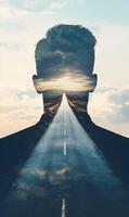 Man's silhouette encapsulating a journey leading towards the horizon, dreams, and future goals photo