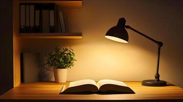 Illuminated study space with an open book under a warm desk lamp, creating a cozy atmosphere photo