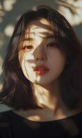 Captivating asian woman portrait with soft lighting and shadows casting a tranquil atmosphere photo
