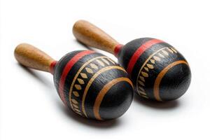 Colorful wooden maracas on a white background for musical fun photo