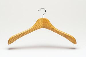 Wooden hanger on a plain background indicating simplicity and utility photo