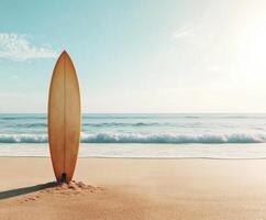 Surfboard stands on golden sand at a tranquil beach during sunset photo