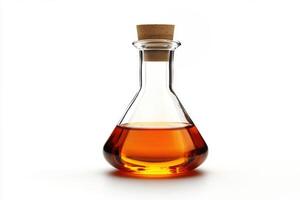 Clear glass flask filled with amber liquid on white background photo