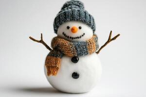 Snowman with knitted accessories in winter setting photo