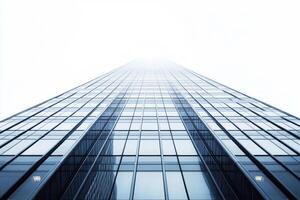 Skyscraper reaching into a foggy sky in an urban setting photo