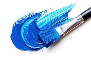Bold brush strokes of blue paint on white canvas photo