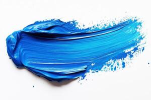 Vibrant blue paint smeared on a white canvas creating texture photo