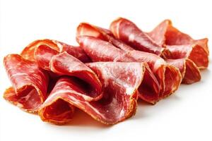 Slices of cured meat arranged on a white background photo