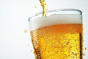 Freshly poured golden beer with bubbles and foam photo