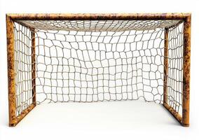 Rusty soccer goal with worn net positioned on a plain background photo
