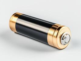Battery resting on a clean surface with gold accents photo