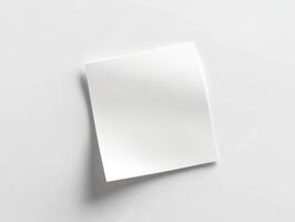Blank sticky note on a clean white surface for notes photo