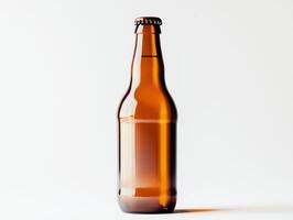 Empty amber glass bottle of beer displayed against a light background photo