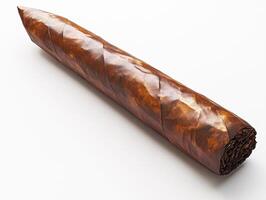 Hand-rolled cigar resting on a white surface with a smooth finish photo
