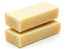 Natural soap bars stacked on each other, showcasing texture and color photo
