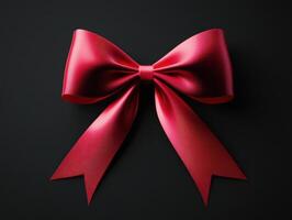 Beautiful red ribbon bow on dark background for gift wrapping photo
