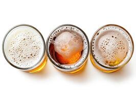 Variety of beers displayed in glass mugs with frothy tops photo