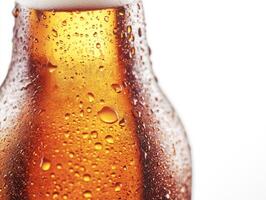 Refreshing cold beer in a clear glass bottle with condensation photo