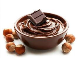 Delicious chocolate hazelnut spread in a bowl with nuts photo