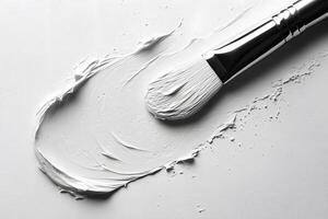 Artistic Expression with White Paint Brush Stroke on Canvas - Minimalist Design photo