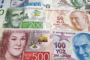 Stack of Swedish krona and Turkish lira photo