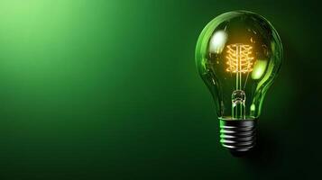 A green light bulb with a green stem inside photo