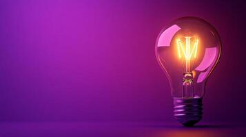 A light bulb is glowing in a purple light photo
