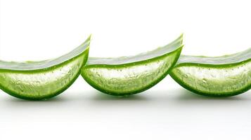 Three slices of aloe vera are arranged in a row photo
