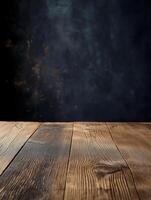 Close-up of wooden table with side light on dark textured wall photo
