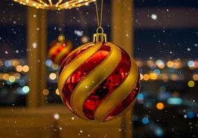 Red and gold christmas ball hanging on the window with cityscape background photo