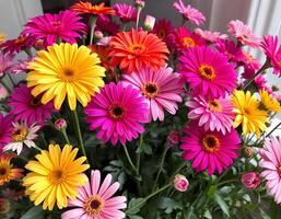 Colorful gerbera daisies in a vase. photo
