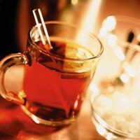 A glass of tea with a straw in it photo