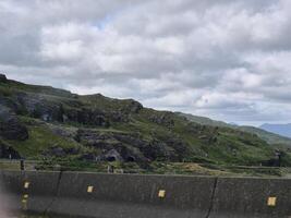 A view of a mountain from a car window photo