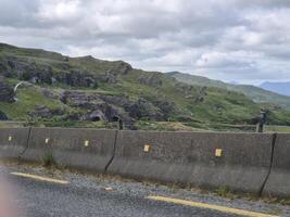 A view of a mountain from a car window photo