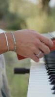 Man Tunes Digital Music Keyboard In Countryside In Nature Outdoors video