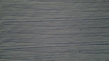 Aerial top down view of a snowy field in February 2025 video