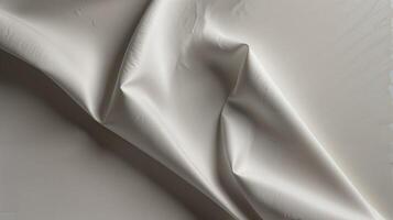 A white sheet of fabric with a white background photo