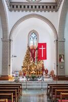 Altar with Jesus Christ in interior of Christian Catholic church. Cathedral of Sacred Heart of Jesus. Tashkent, Uzbekistan - April 18, 2024 photo