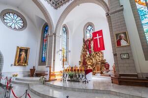 Altar with Jesus Christ in interior of Christian Catholic church. Cathedral of Sacred Heart of Jesus. Tashkent, Uzbekistan - April 18, 2024 photo