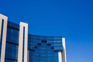 a fragment of the facade of a modern futuristic building photo