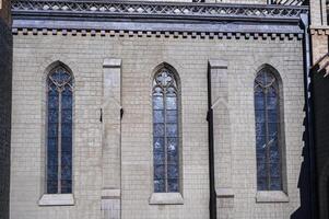 windows in stone wall of the Cathedral of the Sacred Heart of Jesus in Tashkent in Uzbekistan photo