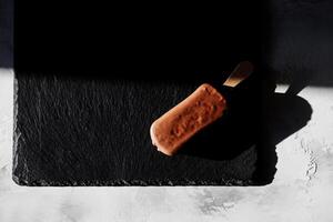 Top view Ice cream on stick with chocolate photo
