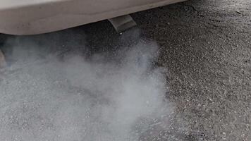 exhaust pipes, close-up . Emissions from an internal combustion engine running on gasoline. Smokes fill the environment with toxic gases. video