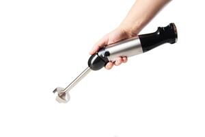 Modern immersion blender with a chopper in hand on a white background photo